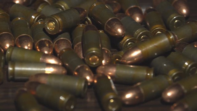 Bullets scattered on the table. 4k