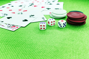 Dice and chips on a green poker table