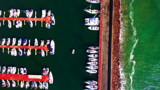 Aerial view boats leaving the marina
