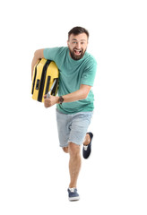Man with suitcase running on white background. Vacation travel