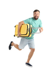Man with suitcase running on white background. Vacation travel