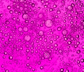 purple bubbles in water close-up abstract background