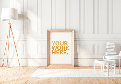 Wooden Framed Poster Leaning on White Wall Mockup