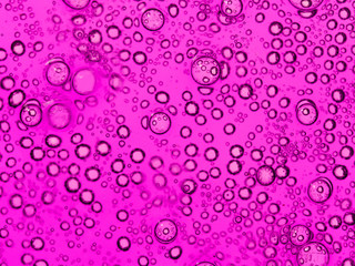 purple bubbles in water close-up abstract background