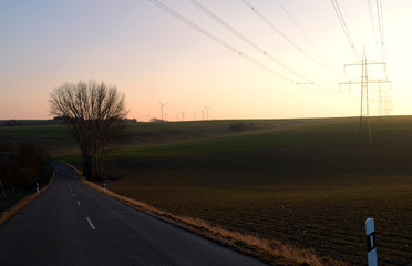Ponitz / Germany: High voltage power line near Gruenberg in Eastern Thuringia in the deep afternoon sun