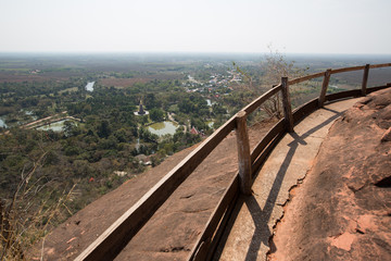 wooden bridge and old wooden banister, walkway around stone mountain. dangerous walkway made by wooden in Thailand - Powered by Adobe
