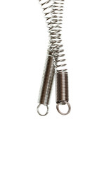 dark metal spring laying isolated on white background