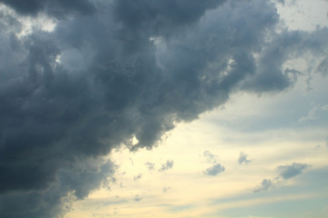 Naklejka na ściany i meble A large gray rain cloud. Background. Landscape.