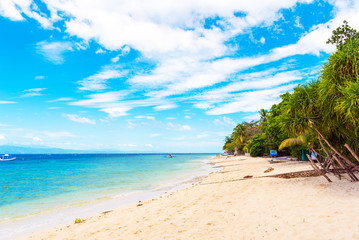 Obraz na płótnie Canvas View of the sandy beach in Moalboal, Cebu, Philippines. Copy space for text.