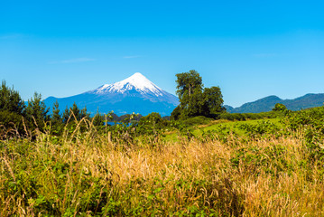 Fototapeta premium Volcano Osorno in national park Vicente Perez Rosales, Chile. Copy space for text.