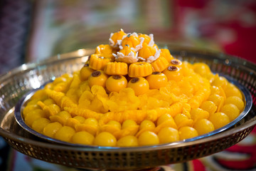 Close up Thai dessert in wedding ceremony. Sweets made from egg, syrup and coconut milk. Thai appetizer, local sweets. ingredient of dessert.