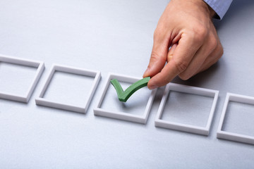 Man Placing Check Mark In Box