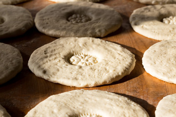Fototapeta na wymiar process of preparing Uzbek bread