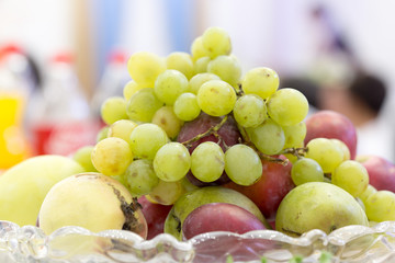 grapes, fruit on the vase on the table