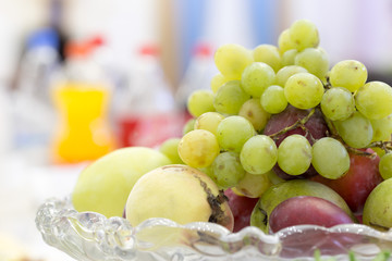 grapes, fruit on the vase on the table