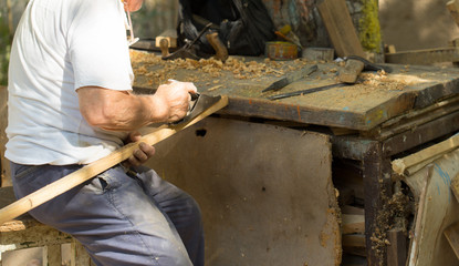 grandfather working on his Woodworking shop
