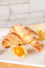 Small croissant with physalis fruits