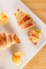 Small croissant with physalis fruits