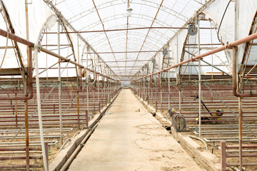 Empty greenhouse with soil prepared for cultivation of new plants