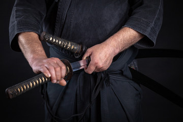 Samurai handle a japanese katana sword and a katana on a tatami