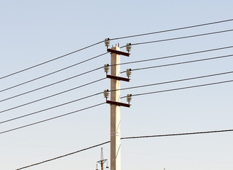 electric pole power lines and wires with blue sky