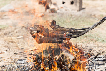 traditions of Kazakh people, slaughtered a ram and with the help of the fire removed the hair on the legs. This puts the meat on top of the national dishes beshbarmak.