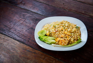 Crab meat fried rice, Khao Pad Poo. Thai famous street food. Thai recommend menu for tourist. fried rice with crab meat and egg, cucumber on side dish.