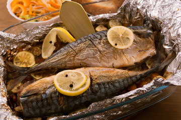 Baked mackerel with lemon and black pepper in foil.