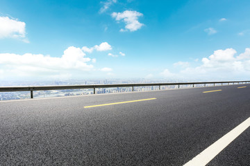Panoramic skyline and buildings with empty road