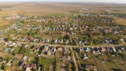 Top view of the village. The village of Poltavskaya. Top view of the village. One can see the roofs of the houses and gardens. Village bird eye view.