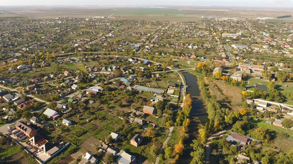 Top view of the village. The village of Poltavskaya. Top view of the village. One can see the roofs of the houses and gardens. Village bird eye view.