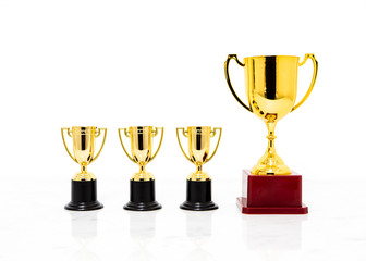 Golden trophy cup isolated on white background.