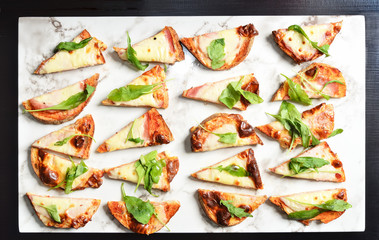 Grilled sourdough bread with ham, cheese and vegetable on buffet table 