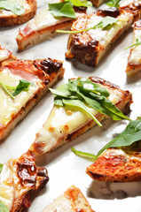 Grilled sourdough bread with ham, cheese and vegetable on buffet table 