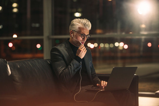 Mature businessman working late at night in office