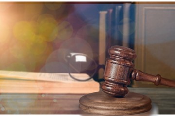 Wooden judge gavel on blurred background