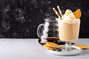 Caramel coffee latte in a dessert glass