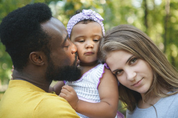Portrait of Happy Smiling African American and white woman Family/