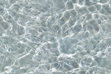 Surface clean water. White sand.