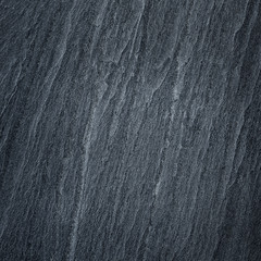 Dark grey black slate stone background or texture.