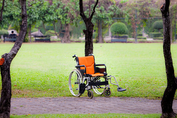 Empty wheelchair parked in  walk way. Empty wheelchair standing alone in a patient room. Filter effect with copy space. Wheelchair park