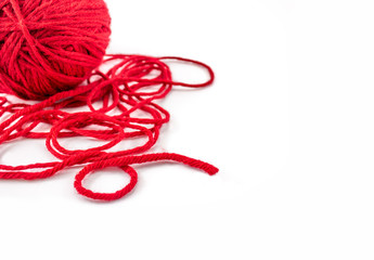 Red knitting yarn for handicrafts isolated on white background