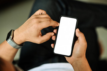 Man holding smart phone with blurred background. For Graphic display montage.
