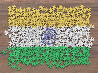 Flag of the India in disorganized pieces of a puzzle.