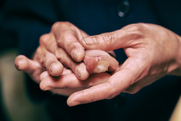 Man's hand close up of making sushi