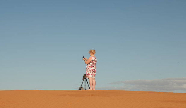 Outback Australia and its dry landscape full of relics bone fossils and a lone female taking photos