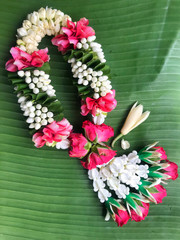 Beautiful garland on green banana leaf.