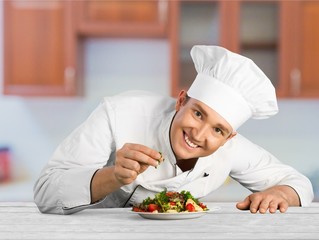 Portrait of a male chef cook preparing