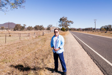 Outback Australia and its dry landscape with a single male looking for a lift!