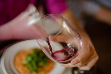 wine being pouring into a glass closeup